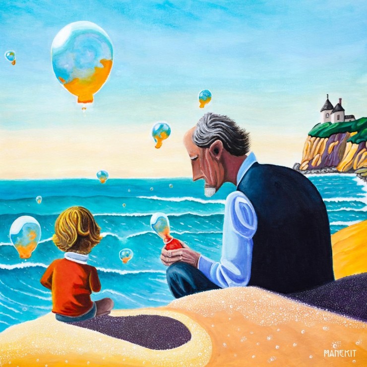 A grandparent and a child sitting on a beach, watching colorful bubbles float above the ocean, with a coastal house in the background.